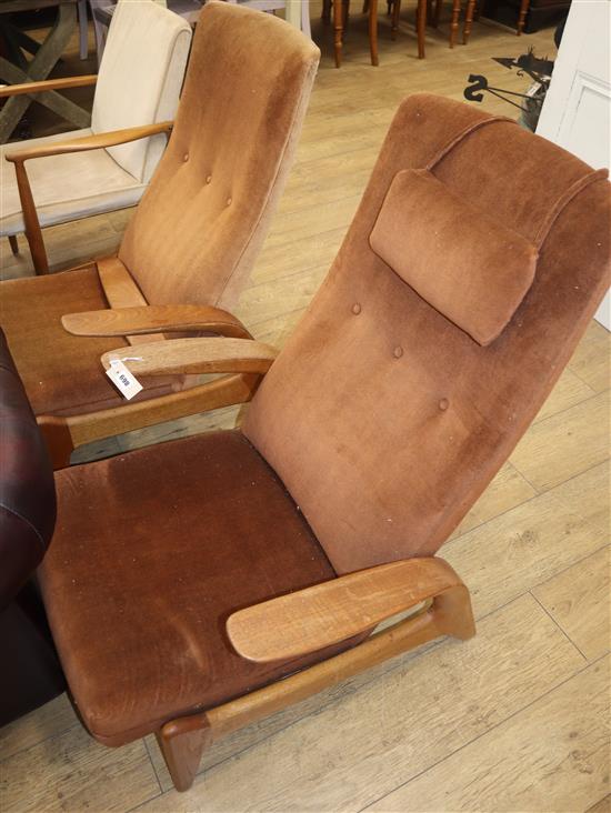 A pair of Gimson and Slater rocknrest teak reclining chairs (one a.f.)